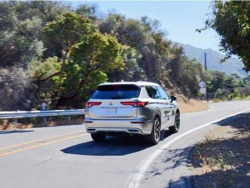 2023 Mitsubishi Outlander driving in Plano